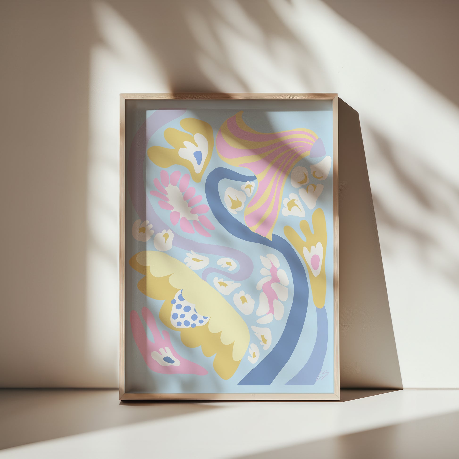 Blue Swirl Poster in wooden frame leaning against white wall - abstract wall art with organic flowing flowers in blue and pastel tones - modern Scandinavian interior styling 30x40 cm