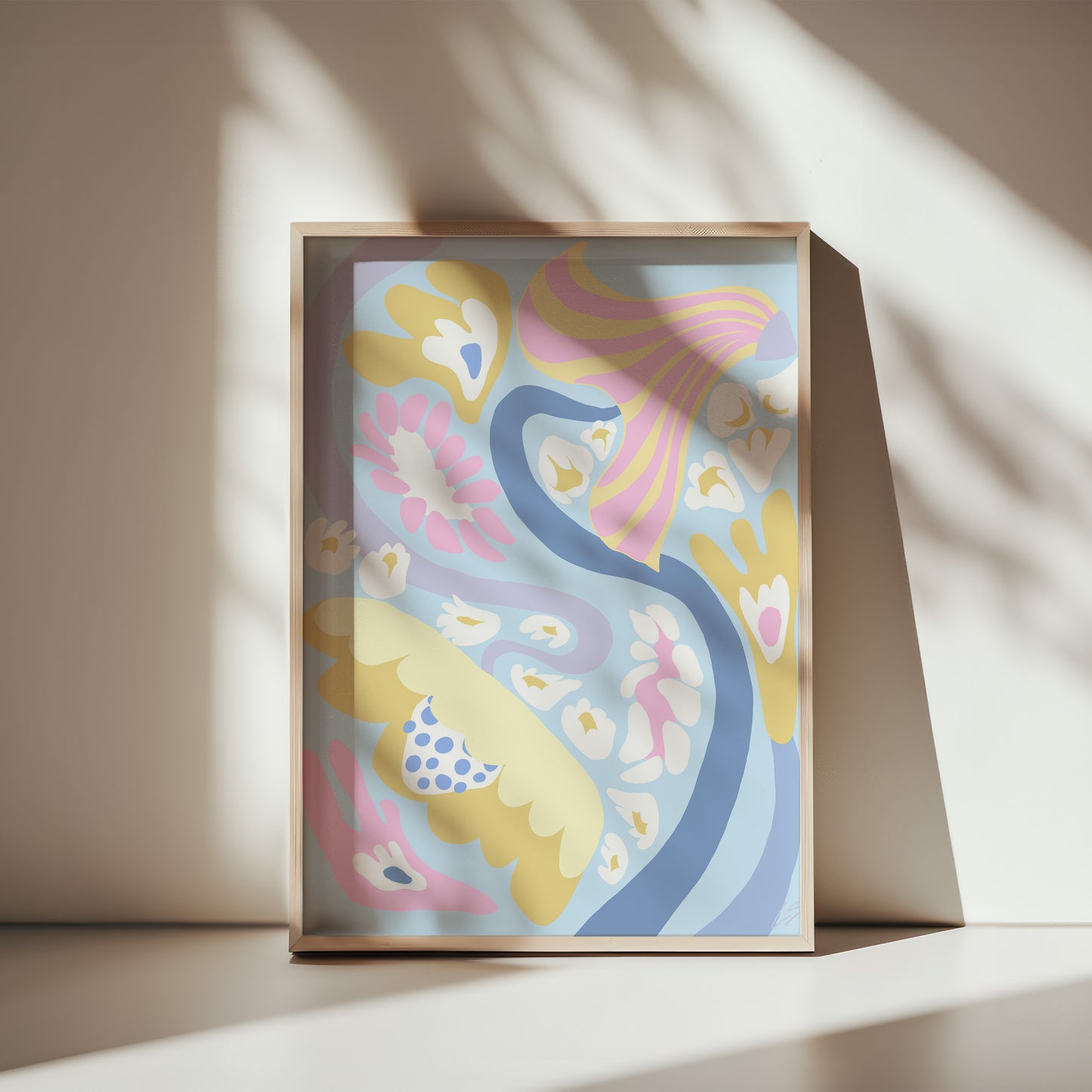 Blue Swirl Poster in wooden frame leaning against white wall - abstract wall art with organic flowing flowers in blue and pastel tones - modern Scandinavian interior styling 30x40 cm